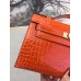 Hermes Orange Kelly Pochette Shiny Niloticus Crocodile Bag